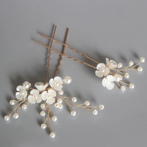 Set of two gold beaded flower hair pins with white pearls for elegant bridal hair styling
