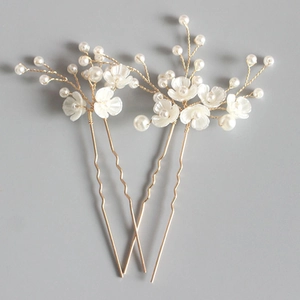 Three-piece set of bridal floral hair pins with white pearls and gold branches