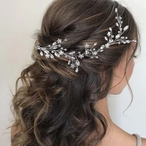 Elegant bridal hair vine with silver crystal flowers and leaves for wedding hairstyles