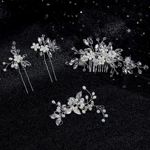 Silver bridal hair accessory set with pearls and crystals on black glitter background