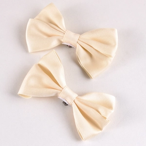 Elegant pair of cream satin bow shoe clips with silky double-layered design for bridal heels