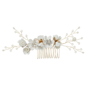 Detailed view of handmade white fabric flower bridal hair comb with pearls and rhinestones