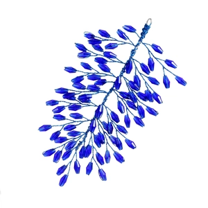 Detailed view of handmade dark blue crystal beads and woven wire hair accessory headband
