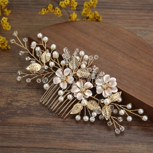 Detail of handcrafted gold floral hair comb with pearls and rhinestone crystals