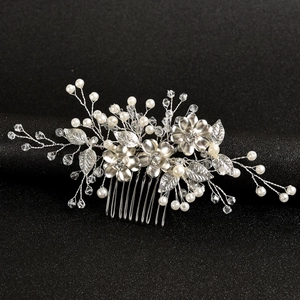 Handmade bridal hair comb with silver metal flowers, rhinestones and pearls on black stand