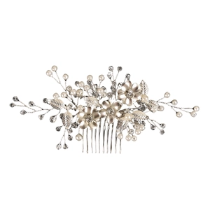 Detailed macro view of silver flower bridal hair comb with pearls and crystals
