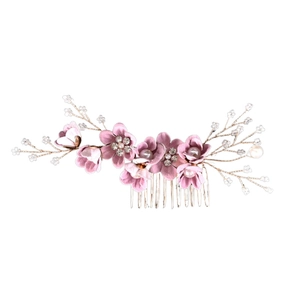 Detailed shot of pink floral bridal hair comb with pearls, crystals and gold wire stems