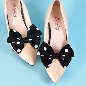 Nude patent leather pointed flats with retro black and white polka dot bow decorations