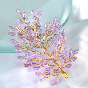 Macro detail of handmade lavender crystal leaf headband with twisted gold wire