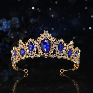 Royal gold metal bridal crown featuring deep blue teardrop gems and sparkling crystals