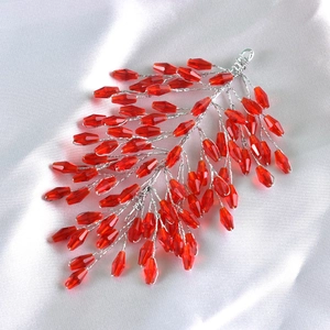 Detailed view of handmade red crystal beaded hairband with silver wire weaving