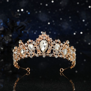 Luxurious rose gold bridal crown featuring white rhinestones and a teardrop-shaped centerpiece