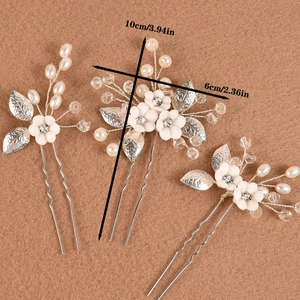 Three-piece bridal hair pin set with white ceramic flowers, pearls and crystals