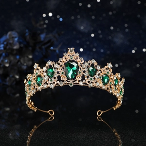 Baroque gold bridal crown with large green drop gemstone and sparkling rhinestones