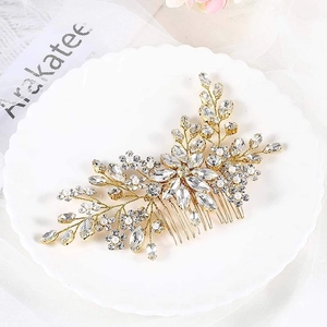 Exquisite bridal hair comb with gold wire, sparkling zircons and white pearls for weddings
