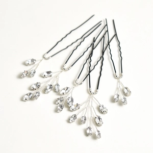 Detail view of 5-piece bridal hair pins with clear crystals and black U-shaped forks