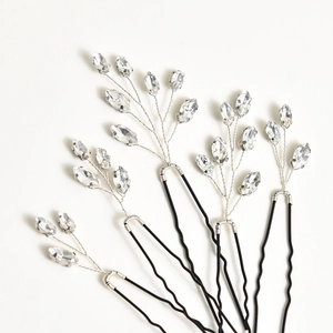 Detailed close-up of 5-piece U-shaped bridal hair pins with clear crystals and black metal base