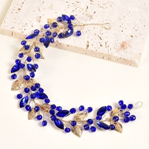 Serre-tête vintage aux cristaux bleus, feuilles dorées et gouttes de saphir élégantes