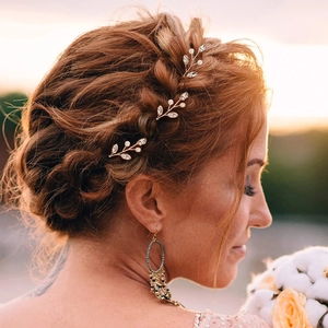 U-shaped bridal hair pins with white pearls and crystals in a golden leaf design set