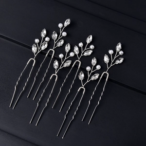 Five silver U-shaped hair pins with emerald crystals and pearls for bridal hair styling