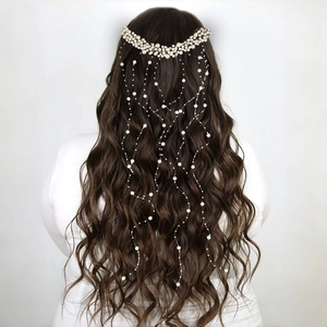 Elegant bridal hair comb with layered pearls and long flowing tassels for wedding hair styling