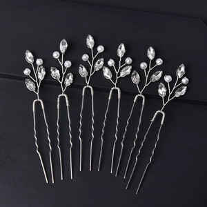 Detailed close-up of 6-piece silver U-shaped hair pins with crystals and white pearls