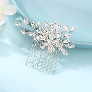 Elegant silver bridal hair comb with rhinestone flowers and pearls for wedding hairstyles