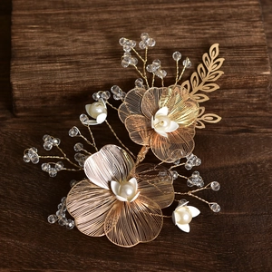 Handmade gold floral bridal hair clip with metal petals, white pearls and crystal beads