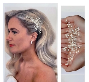 Detailed view of silver bridal hair comb with white pearls and sparkling crystal rhinestones