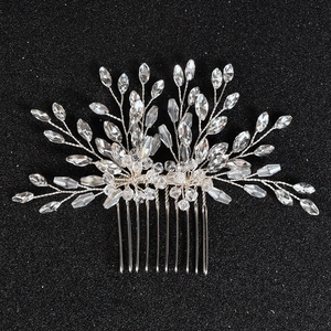 Detail of bridal hair comb with handmade glass crystals and silver wire weaving