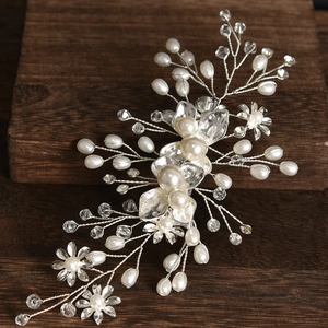 Exquisite bridal hair piece with silver metal flowers, pearls and crystals on wooden base