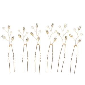 Detail view of 6-piece U-shaped hairpins with gold wires, pearls and emerald rhinestones