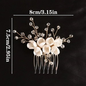 Handmade bridal hair comb with white resin flowers and crystals on a silver metal base
