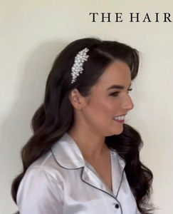 Detail view of pearl bridal hair comb featuring handmade white beads in wave design
