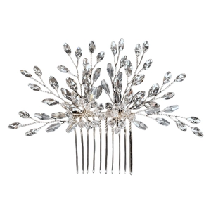 Macro detail of bridal hair comb featuring silver wire branches and crystal beads