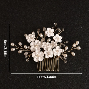 Elegant bridal hair comb with handmade white flowers and pearls on a gold wire base