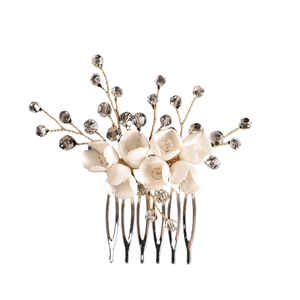Exquisite bridal hair comb with white resin flowers and clear crystal beads on silver metal