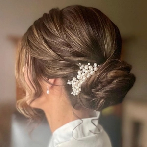 Elegant bridal hair comb with handmade pearls for wedding hairstyles on low bun