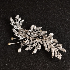 Silver leaf brooch and hair clip with pearls and crystals shown from the back