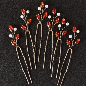 Detail view of 6-piece U-shaped hairpins with red marquise stones and pearls