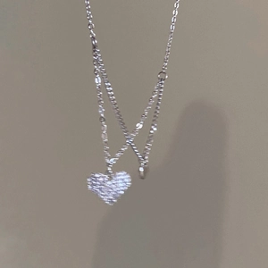 Double-layer silver necklace featuring 3D heart pendants with sparkling cubic zirconia