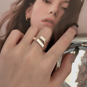 Minimalist silver geometric open ring for women with architectural design worn on finger