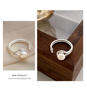 Detailed macro of S925 sterling silver double-layer ring featuring a lustrous pearl