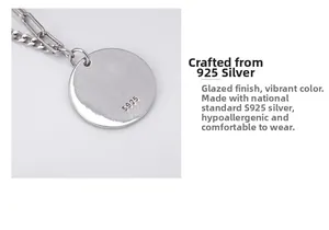 Macro shot of S925 silver round pendant showing the engraved hallmark and glazed finish
