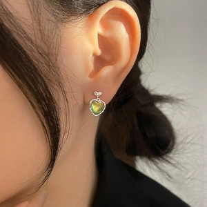 Aurora cat eye heart earrings with green iridescent stones and silver twisted borders