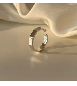 Macro shot of S925 sterling silver stamp on minimalist geometric faceted open ring