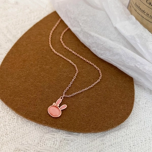Elegant rose gold necklace featuring a cute pink cat's eye stone rabbit pendant with bow