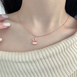 Pink cat eye stone rabbit pendant necklace with bow in rose gold finish for women