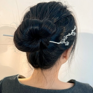Silver plum blossom hair stick with vintage metal branch design for traditional hairstyles