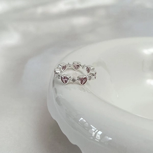Elegant silver ring with heart-cut pink gemstone and sparkling white zircon accents